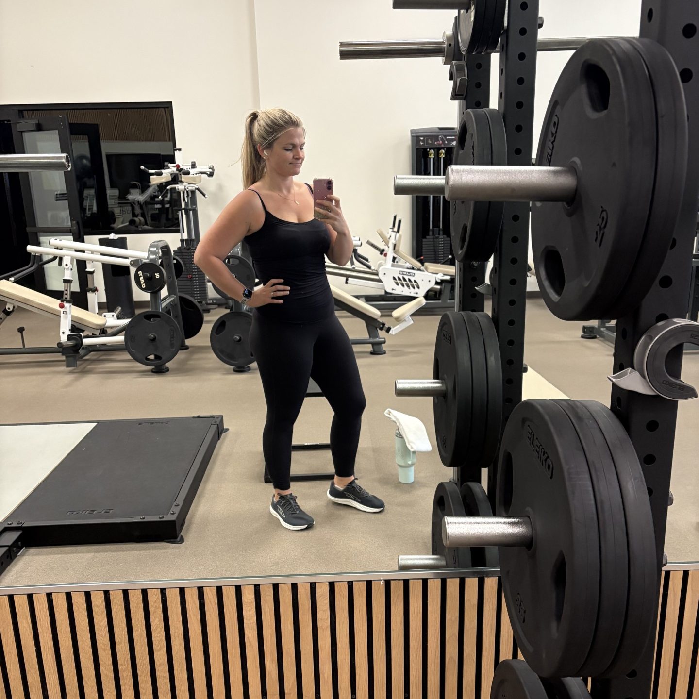 Rachel D. taking a mirror selfie in the somofit gym after Penny was born